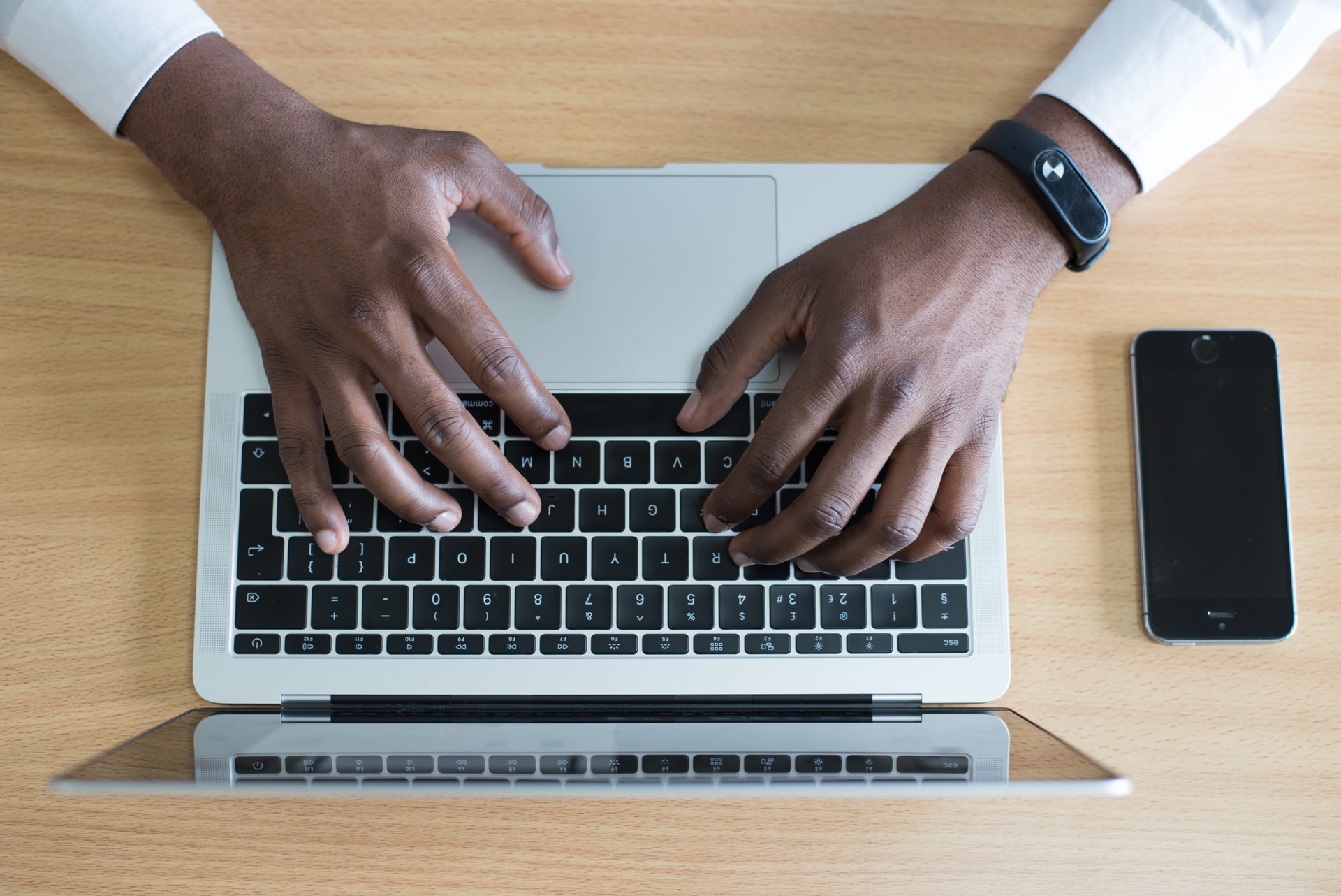 Hands On a Laptop. Photo by Cytonn Photography on Unsplash