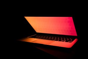 Glowing Laptop in the Dark Photo by Filiberto Santillán on Unsplash