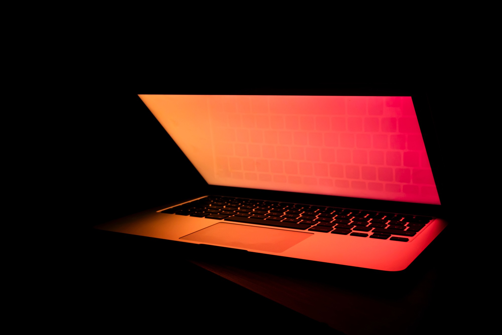 Glowing Laptop in the Dark Photo by Filiberto Santillán on Unsplash