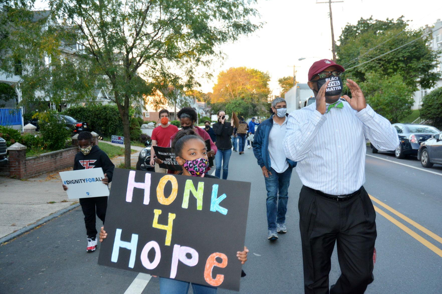 The Rev. James Buck, senior pastor of Grace Baptist Church of Germantown, leads a social justice march down Germantown Avenue last in October 2020. — TRIBUNE FILE PHOTO