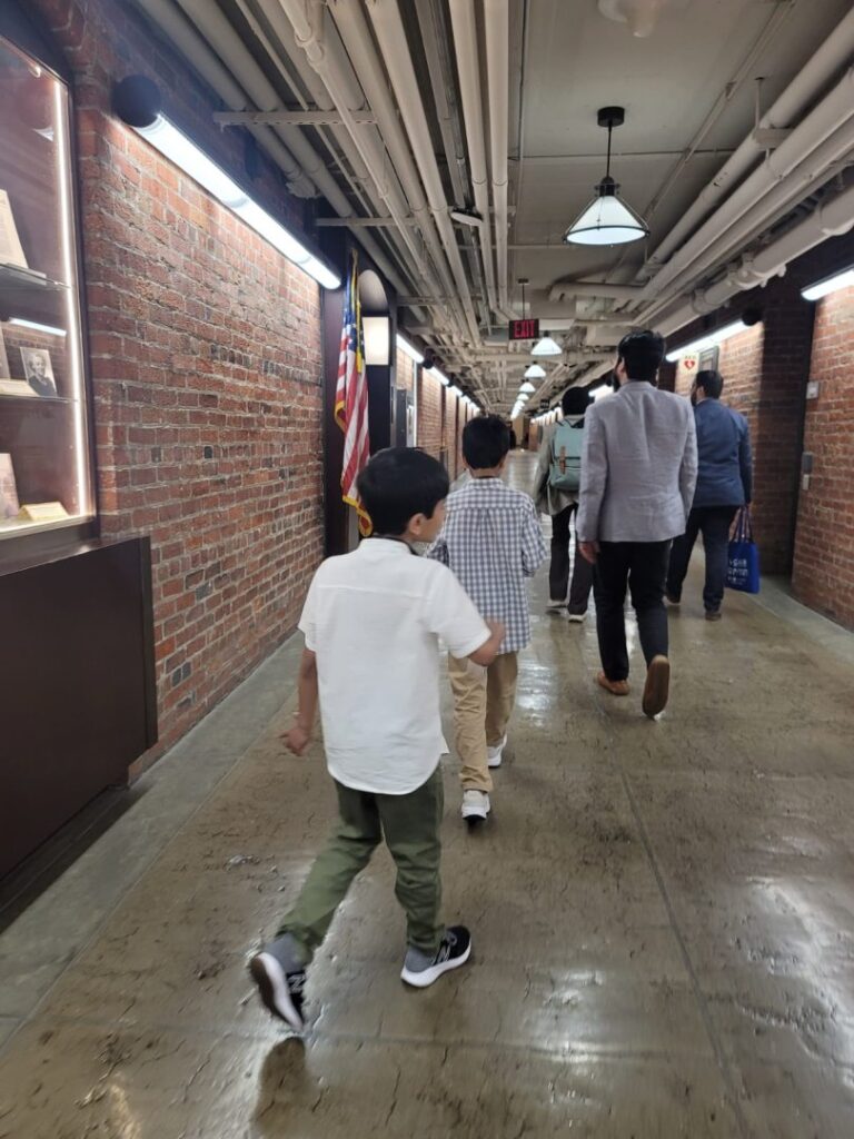 PA group walking in underground tunnel