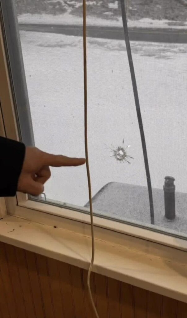 Photo of bullet hole in window of Pike County Islamic Center